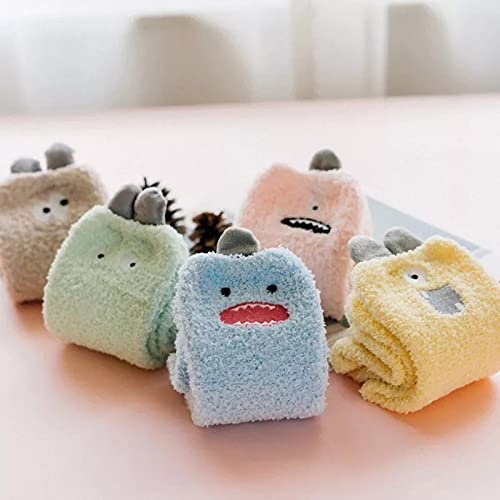A whimsical blue sock displaying a cute face, ideal for adding character to your sock collection.