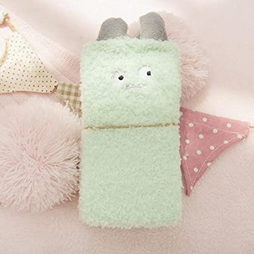A green stuffed animal featuring a friendly face, designed for comfort and companionship.