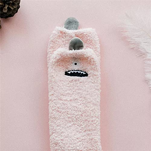 A pink towel embellished with a cute face, offering a delightful and unique addition to your linen collection.