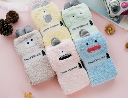 A vibrant pink towel adorned with a cheerful face, perfect for brightening up your bathing experience.