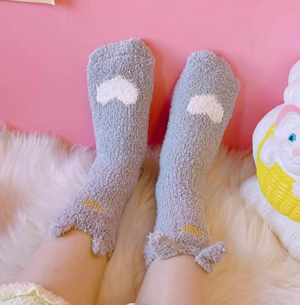 A person showing off their fun cloud-patterned socks, adding a whimsical touch to their outfit.