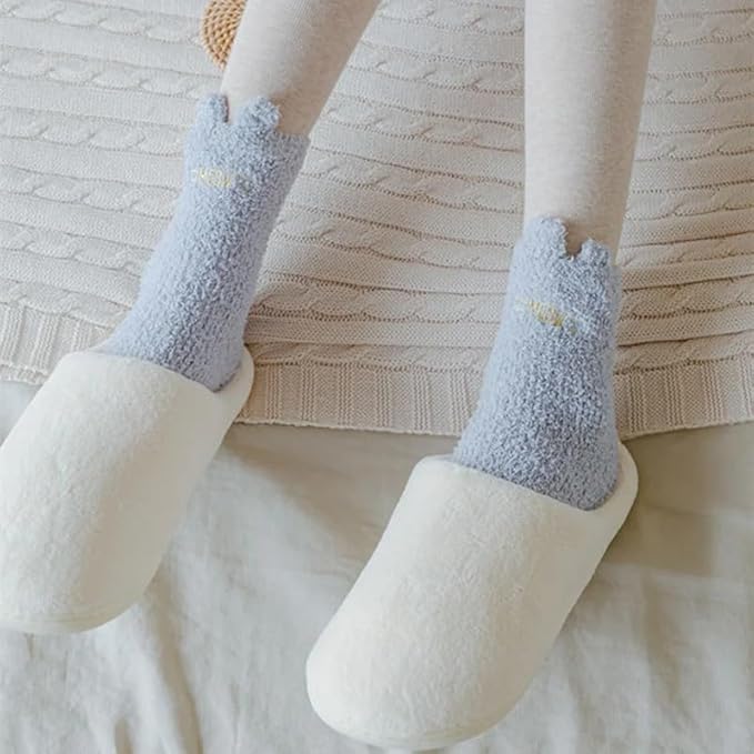 A person proudly displaying their quirky socks featuring cute cloud designs, perfect for a casual day.