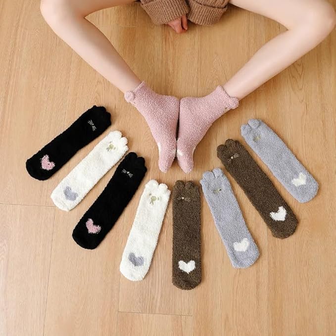 A person wearing colorful socks adorned with clouds, showcasing a playful and relaxed style.