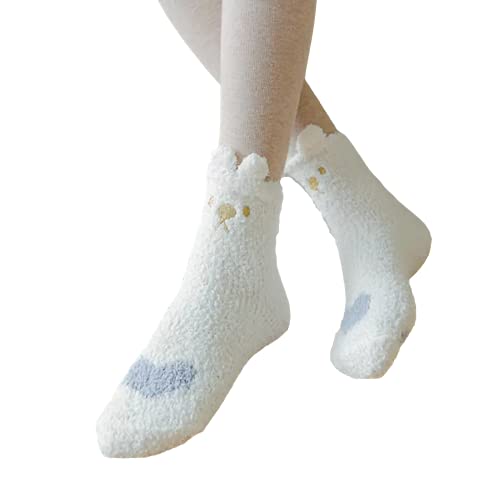 White socks on a woman's legs, showcasing a playful white owl design.