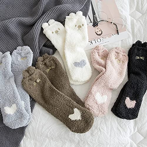 A woman's legs in white socks featuring a charming white owl pattern.