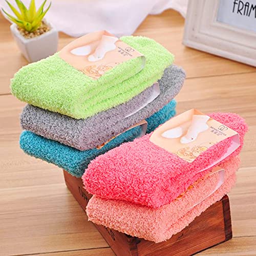 A green towel and a cup of coffee arranged together, evoking a sense of relaxation and comfort.