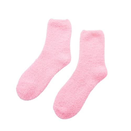 Two pink socks resting on a white background, highlighting their cheerful hue and cozy appearance.