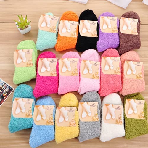 A pair of soft pink socks laid out on a white surface, illustrating their playful color and inviting texture.