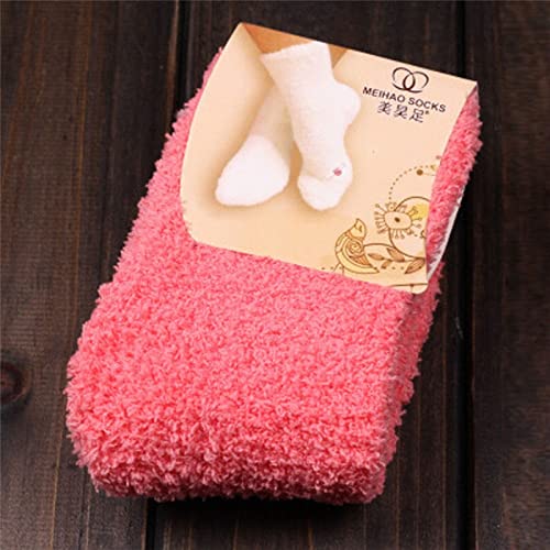 A set of pink socks positioned on a white backdrop, emphasizing their bright color and comfortable design.