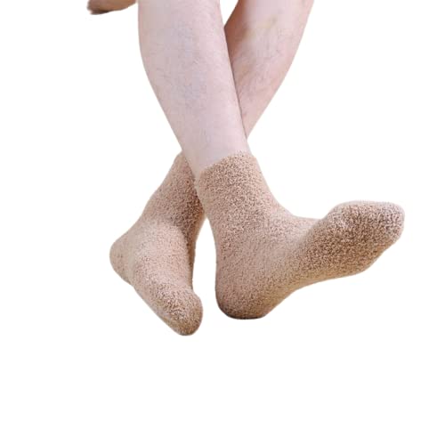 A pair of unique socks accompanied by a wooden box, presenting an appealing contrast between fabric and natural materials.