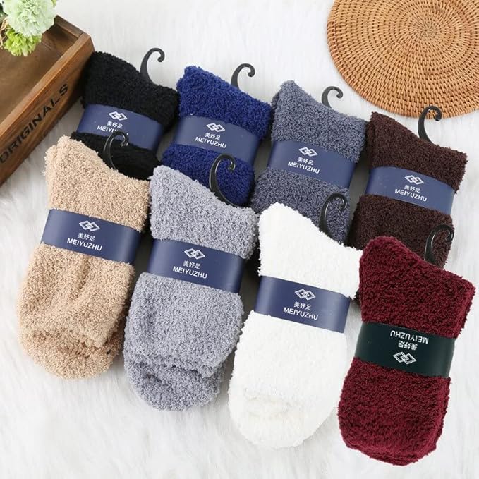 A vibrant pair of socks resting next to a handcrafted wooden box, highlighting a delightful combination of textiles and wood.