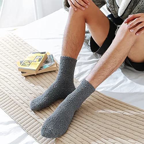A cute pair of socks and a soft ball of yarn arranged on a white surface, inspiring warmth and creativity.