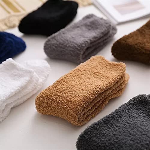 A person lounging comfortably in grey fuzzy socks, radiating warmth and relaxation in a cozy home setting.