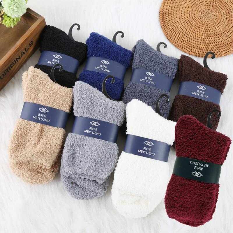 Two white socks adorned with blue and white labels, presented side by side.