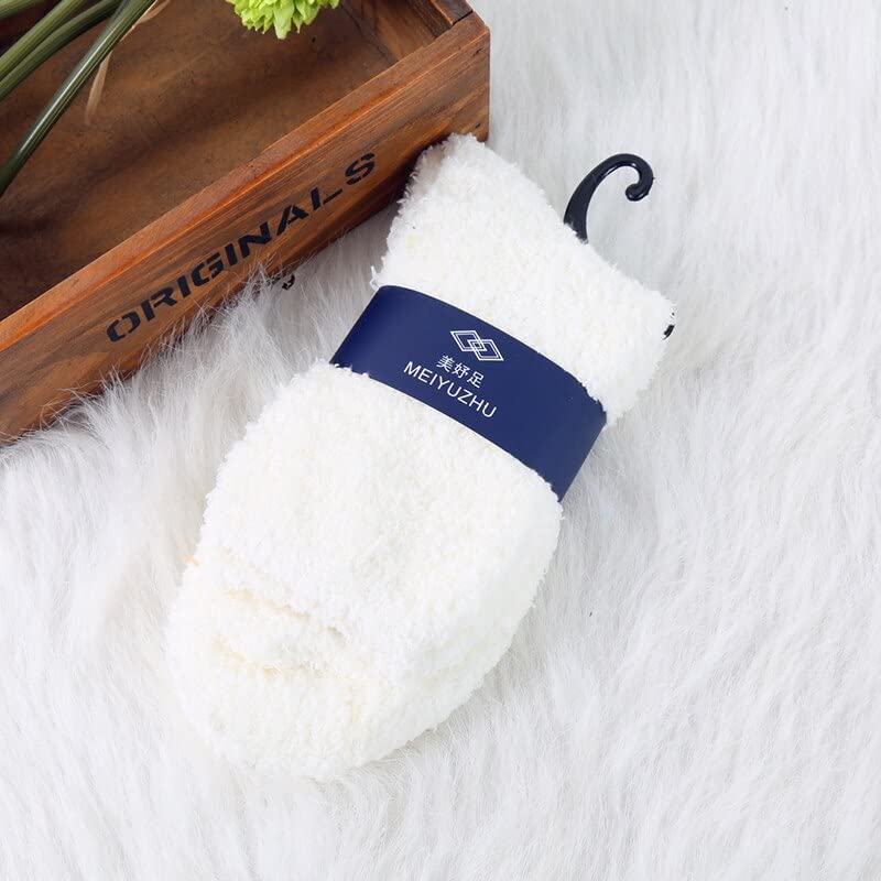 A pair of white socks featuring blue and white labels, neatly arranged for display.