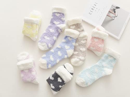 A vibrant pair of blue socks decorated with charming red hearts, ideal for a fun and stylish look.