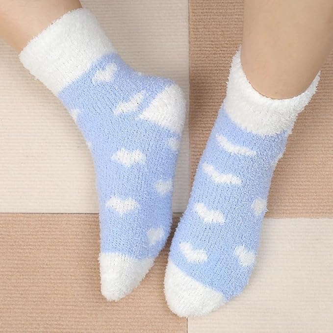 Blue and white socks with heart patterns, combining comfort and style for a delightful addition to your sock drawer.