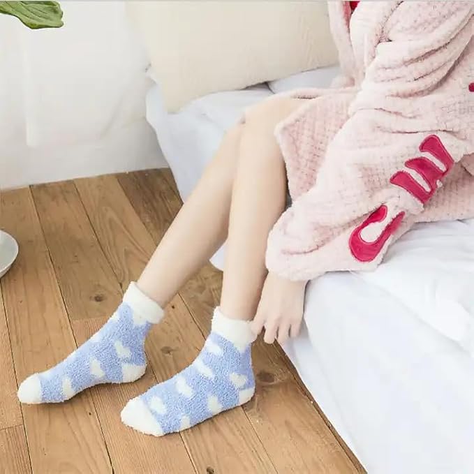 A pair of blue and white socks showcasing heart designs, perfect for expressing your playful side in everyday wear.