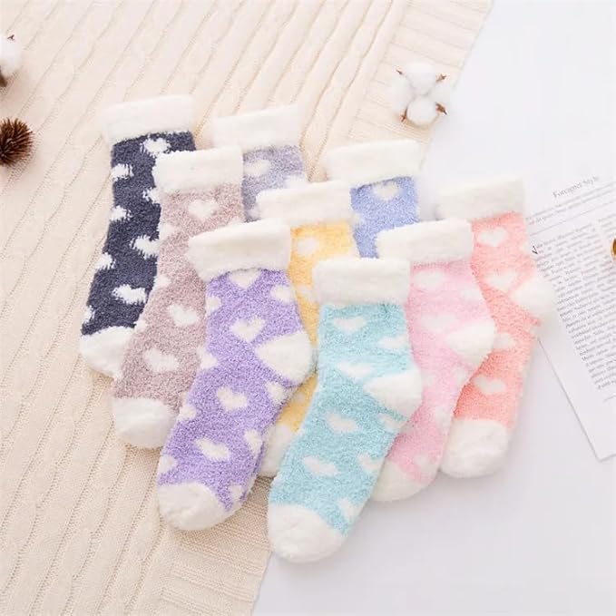 Blue and white socks featuring charming heart patterns, ideal for cozy and stylish wear.