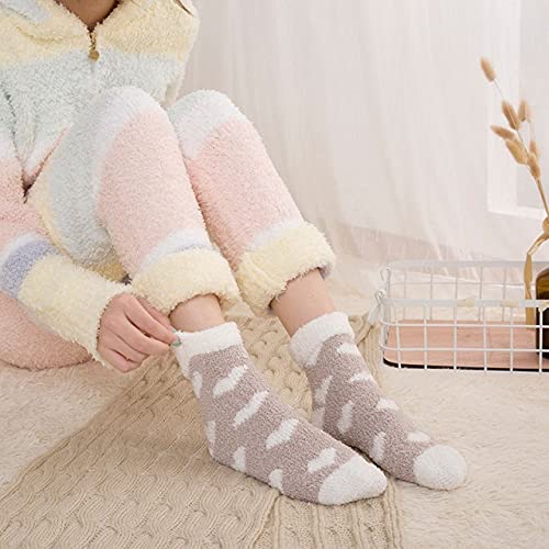 Feet adorned in heart-printed socks, showcasing a playful and cozy style.