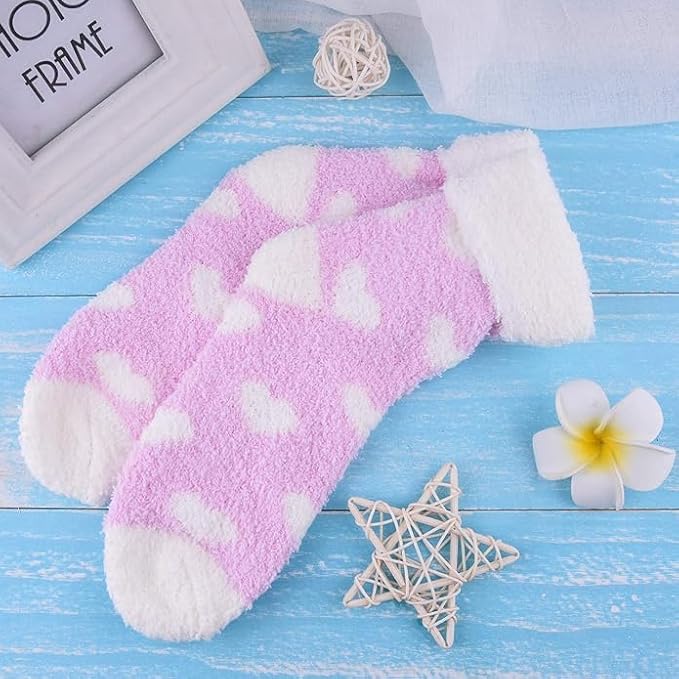 Adorable pink socks with white heart patterns, bringing a fun and cheerful vibe to your wardrobe.