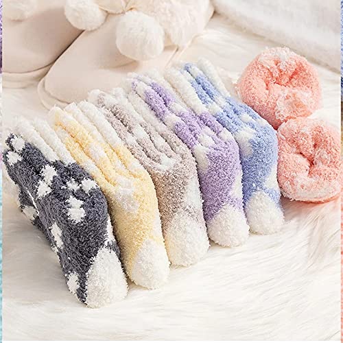 A cozy sock adorned with a charming pink and white heart pattern, ideal for a playful fashion statement.