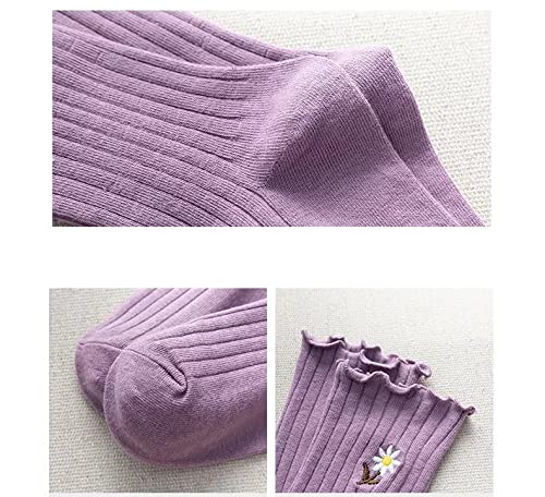 Purple socks featuring a delightful daisy pattern, adding a touch of whimsy to any outfit.