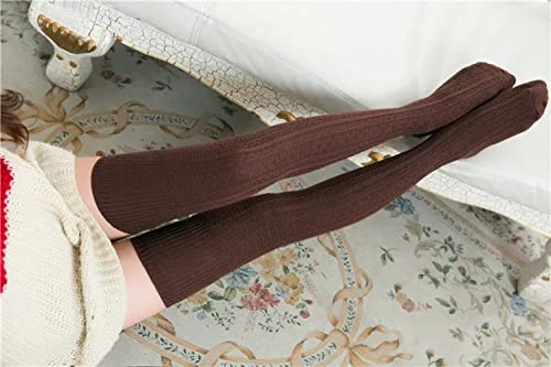 A woman wearing a cozy sweater and knee-high socks, exuding warmth and comfort in a relaxed setting.