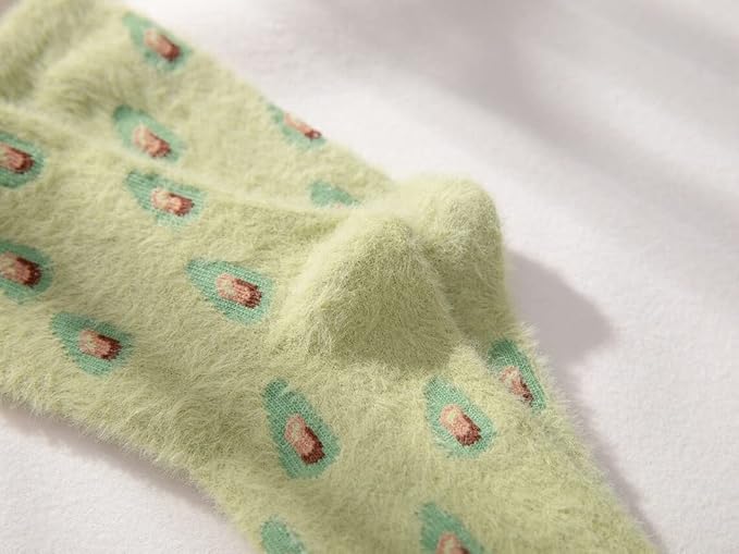 Stylish green socks adorned with cute avocados, perfect for adding a splash of color and fun to your sock collection.