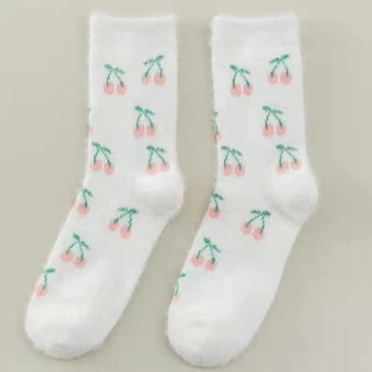 White socks featuring a delightful cherry print, adding a fun and whimsical touch to any outfit.