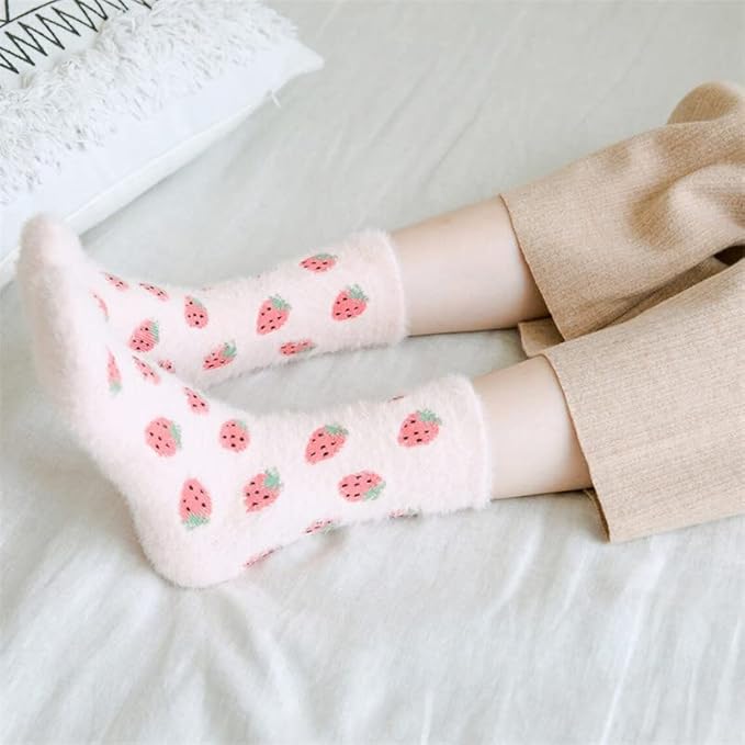 Adorable pink socks showcasing delightful strawberries, a sweet addition to any casual look.