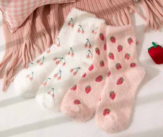 A vibrant pair of pink socks featuring adorable strawberry designs, ideal for cozying up in style.