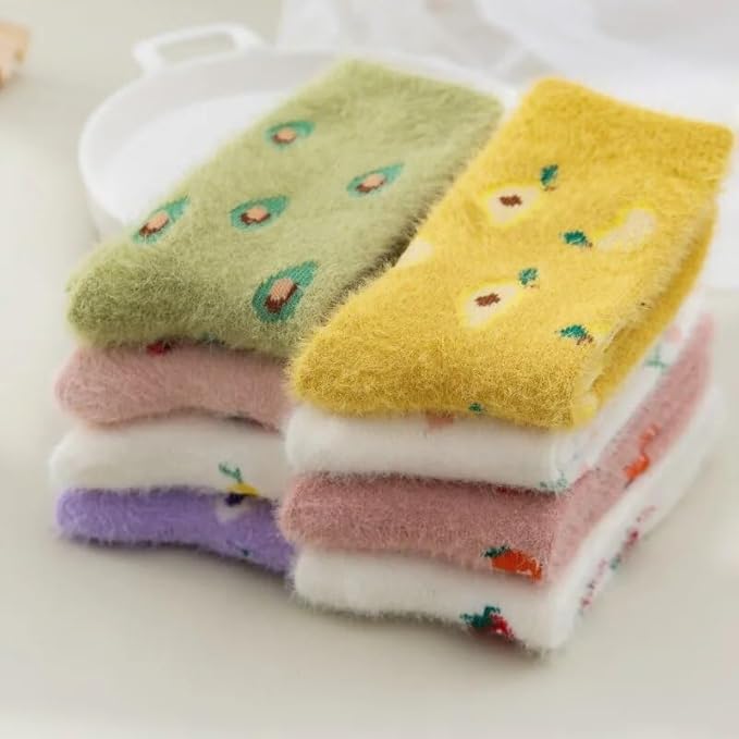 A pair of vibrant yellow socks adorned with colorful fruit patterns, showcasing a playful and cheerful design.