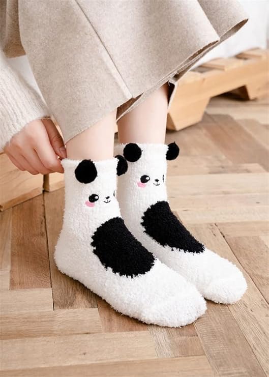 A fun display of two pairs of panda socks, each showcasing charming black and white faces for a playful touch.