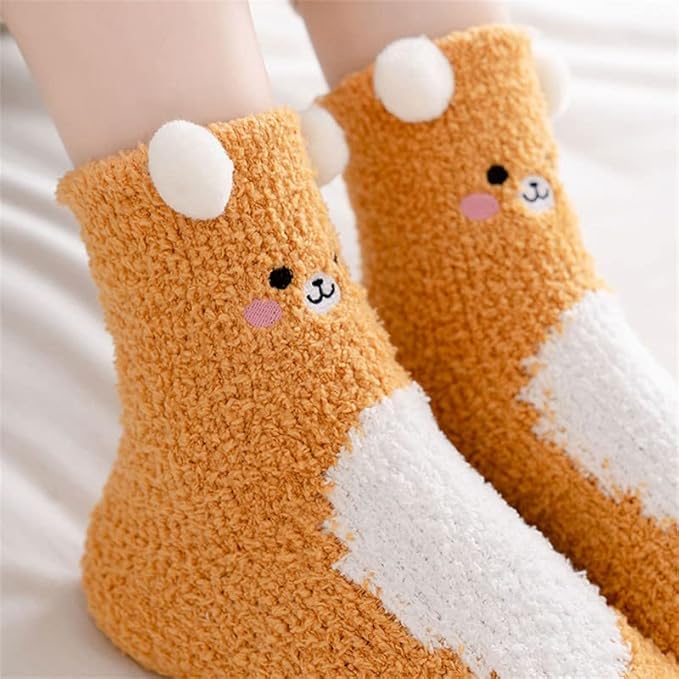 Two pairs of socks featuring adorable brown and white bear designs, perfect for cozy wear.