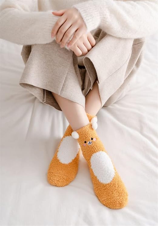 A pair of socks adorned with brown and white bears, showcasing a charming and playful design.