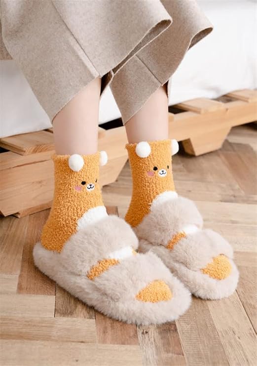 Two pairs of socks illustrated with delightful brown and white bears, suitable for casual and comfortable attire.