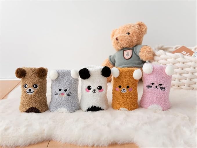 Two sets of socks displaying cute brown and white bear patterns, ideal for adding warmth and style.