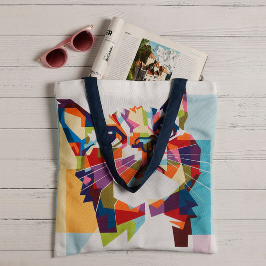 Colorful cat face printed on a tote bag.