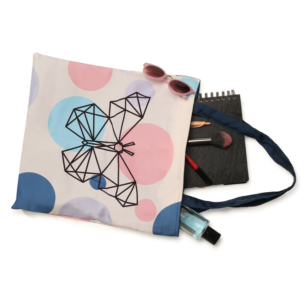 Tote bag adorned with geometric shapes and butterfly.