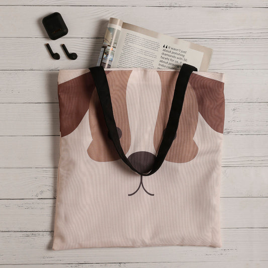 Tote bag with an adorable dog face print, ideal for pet enthusiasts.