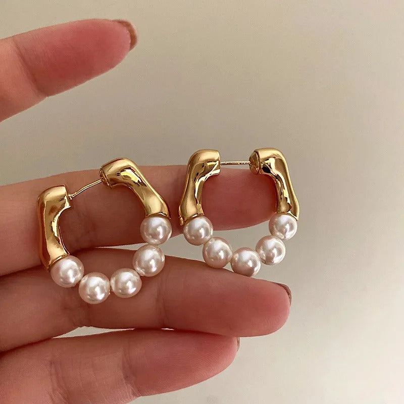 Elegant pearl hoop earrings, a timeless accessory for any occasion.