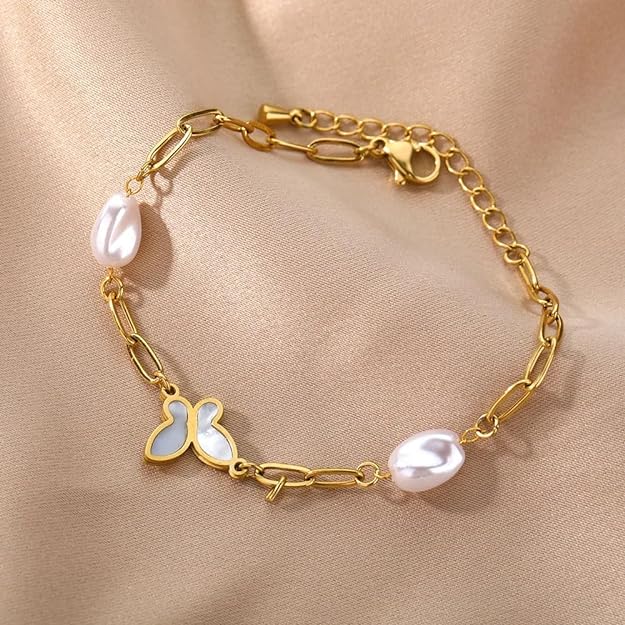 Beautiful gold plated bracelet with white pearl and butterfly accent.