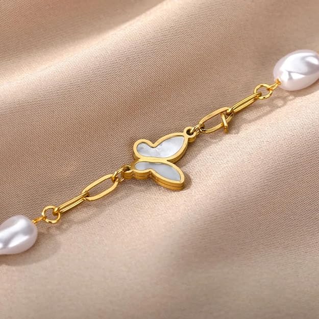 Elegant gold bracelet featuring white pearl and dainty butterfly.