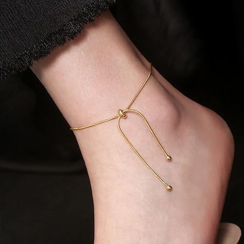 Elegant gold bracelet with a small gold chain, adding a touch of luxury and charm to your wrist.