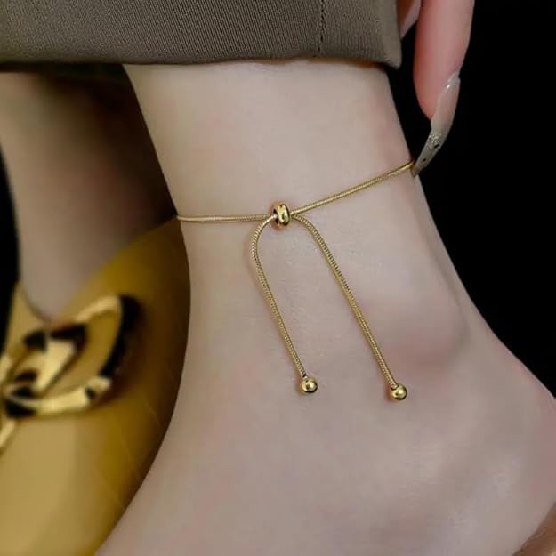 Gold bracelet featuring a dainty gold chain, ideal for accessorizing with a subtle and sophisticated flair.