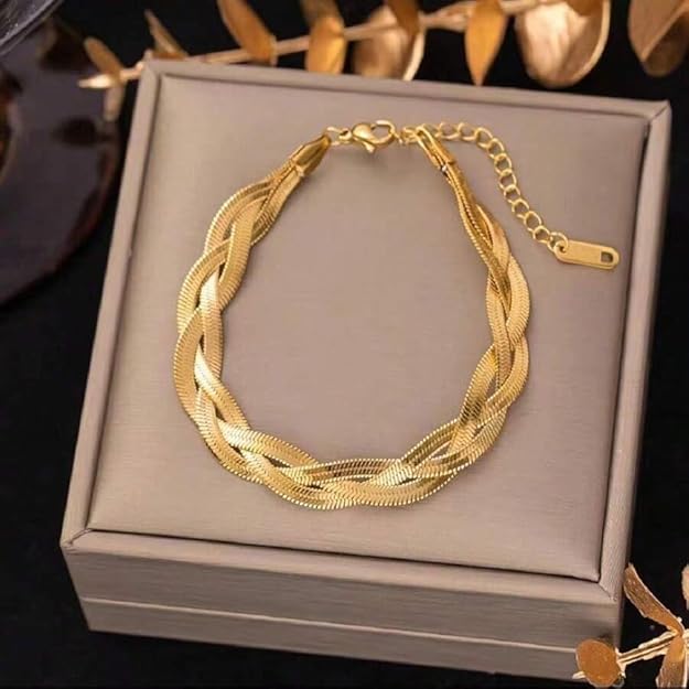 Gold bracelet with chain link, elegant accessory for any outfit.