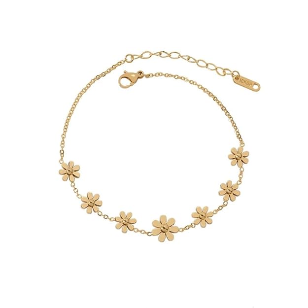 Stylish gold necklace adorned with four delicate flower pendants, a chic accessory for any occasion.