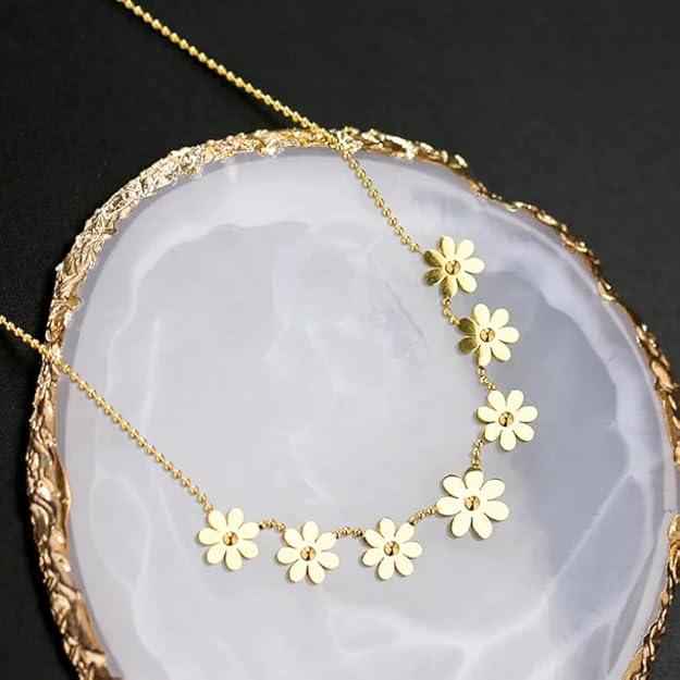 Gold necklace with four charming flower accents, perfect for any occasion.