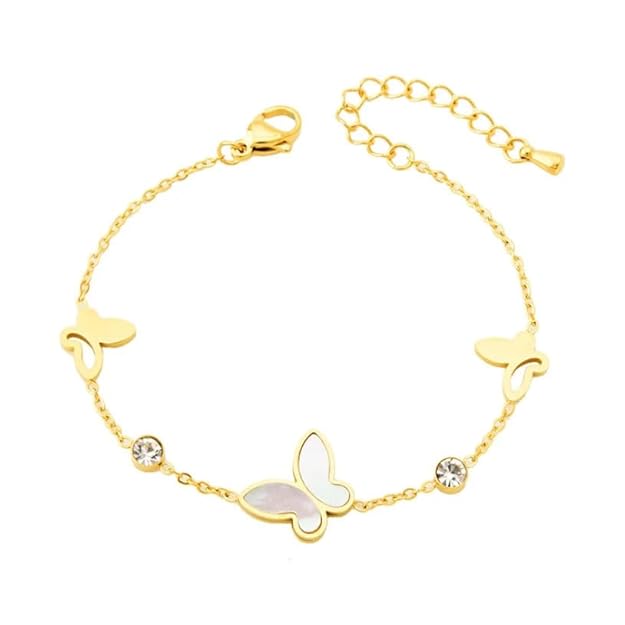 A woman's wrist wearing a delicate gold butterfly bracelet.